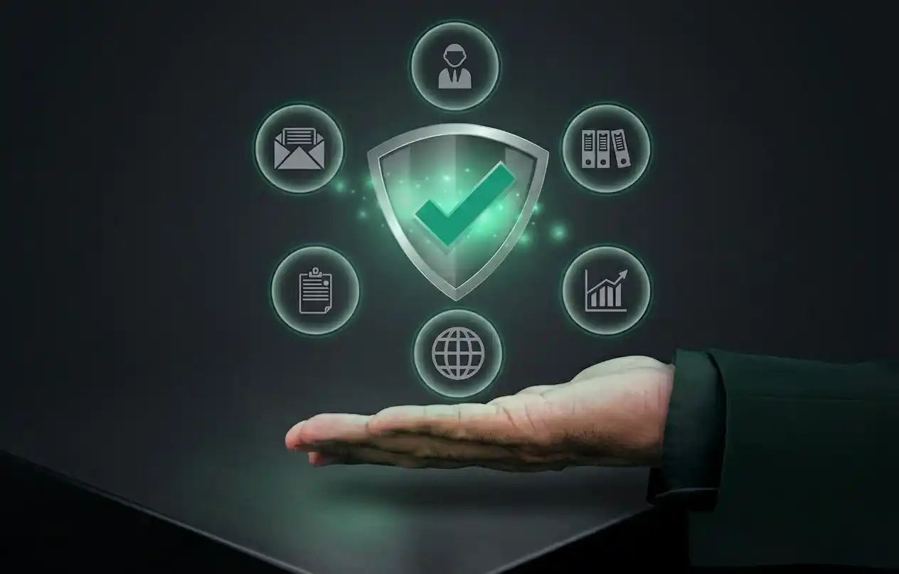 A professional hand holding a glowing shield icon to represent erp-customization-service, focusing on secure and tailored business data solutions.